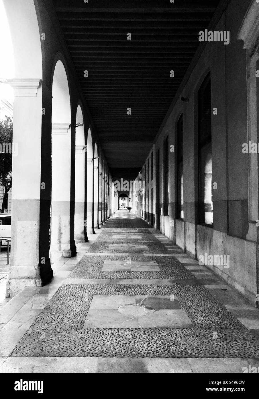 Black and white symmetric pattern street gallery view - Smartphone Captured Stock Image