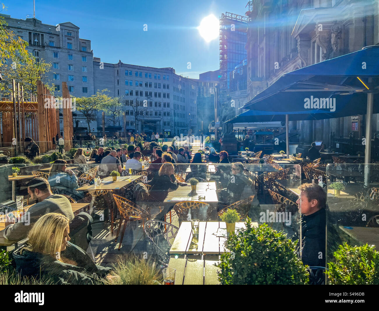 Out drinking and socialising in city square in Leeds city centre Stock Photo