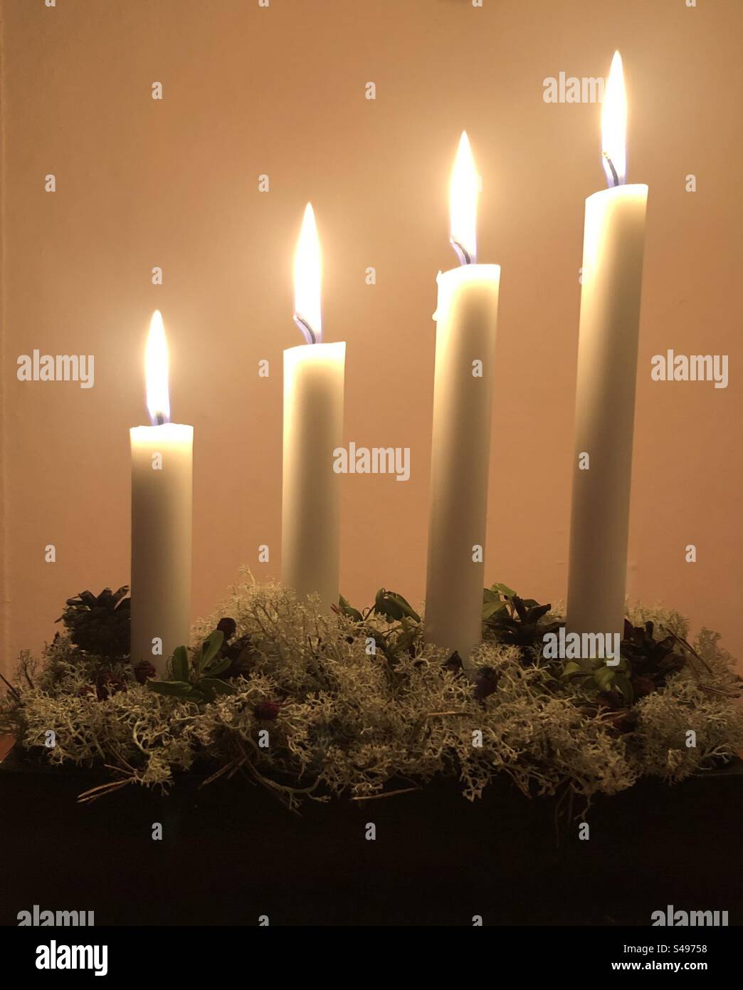 Advent candlestick with four candles lit in turn on each Sunday in Advent, Sweden. - Smartphone Captured Stock Image