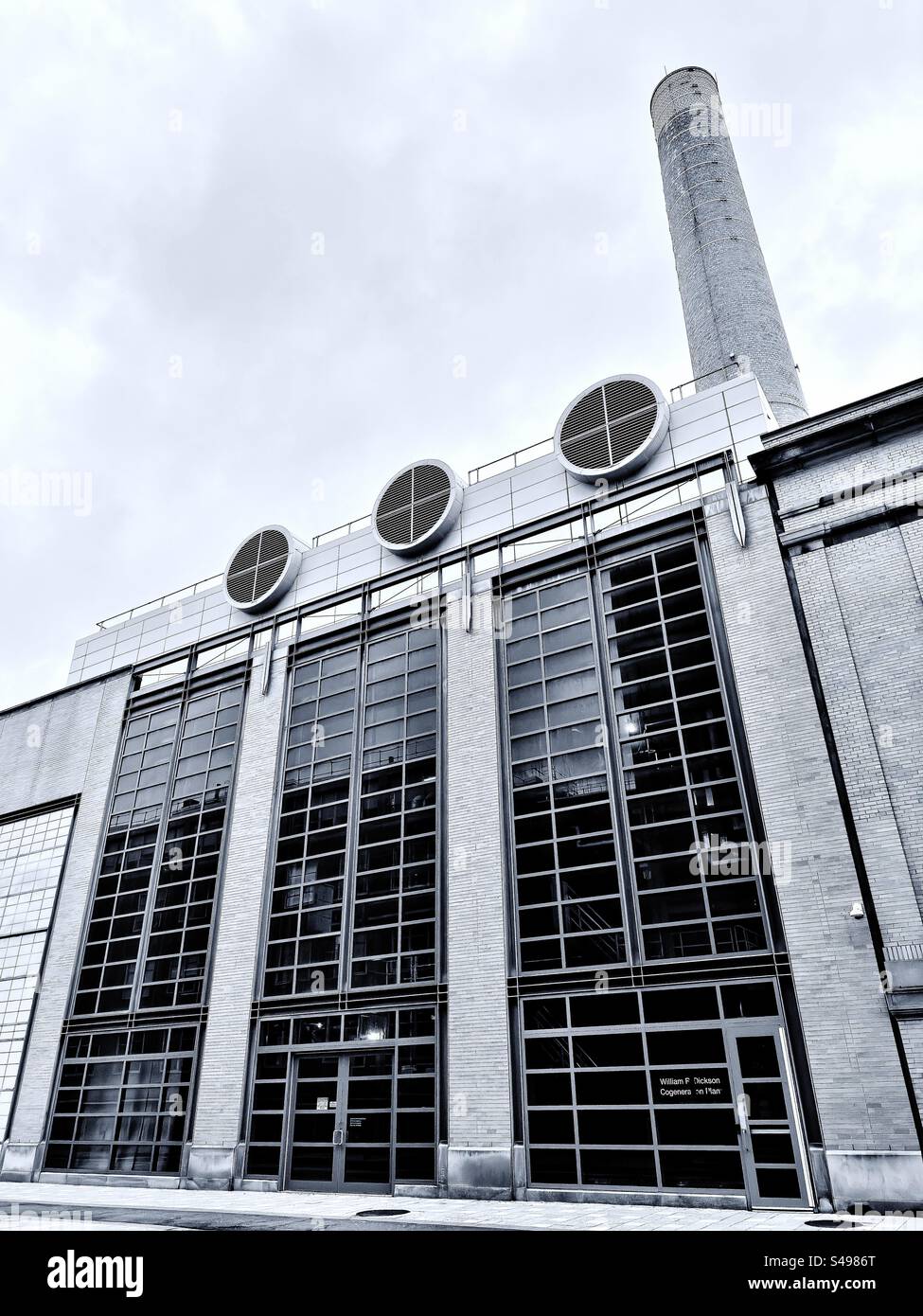 Cambridge, Massachusetts, USA - July 2023:  William Dickson building. The Cogeneration Plant on the campus of Massachusetts Institute of Technology (MIT). Black and white filter. - Smartphone Captured Stock Image