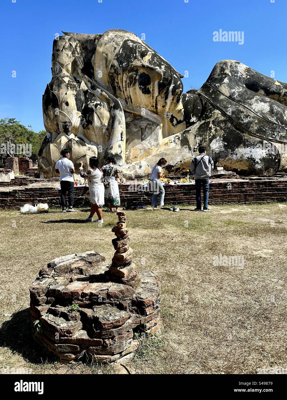 Prayers at the Reclining Buddha - Smartphone Captured Stock Image