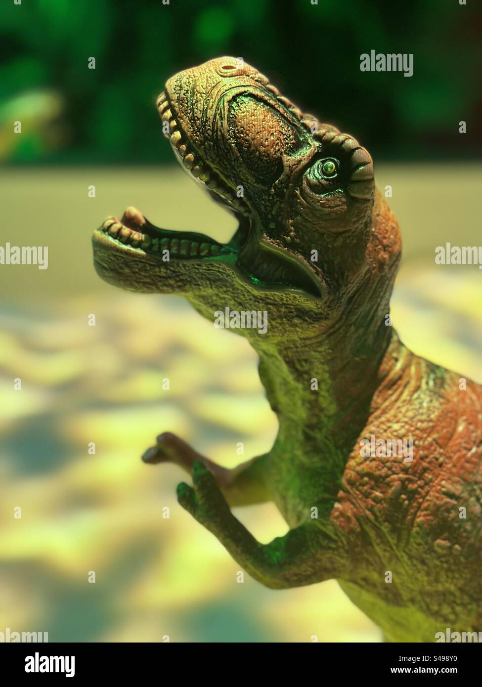 Velociraptor dino with green eyes - Smartphone Captured Stock Image