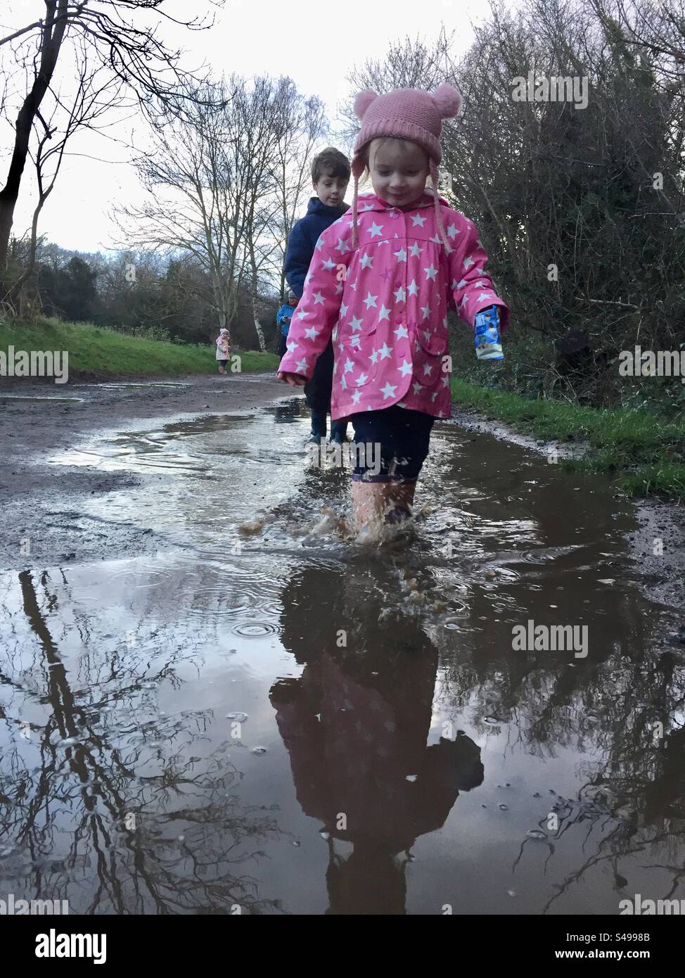Splashing in muddy puddles - Smartphone Captured Stock Image