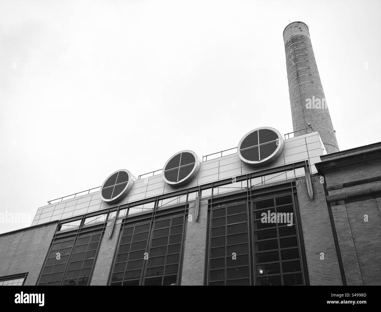 Cambridge, Massachusetts, USA:  Looking up at William Dickson building, the Cogeneration Plant. Power plant on Massachusetts Institute of Technology (MIT) campus. Black and white filter. - Smartphone Captured Stock Image