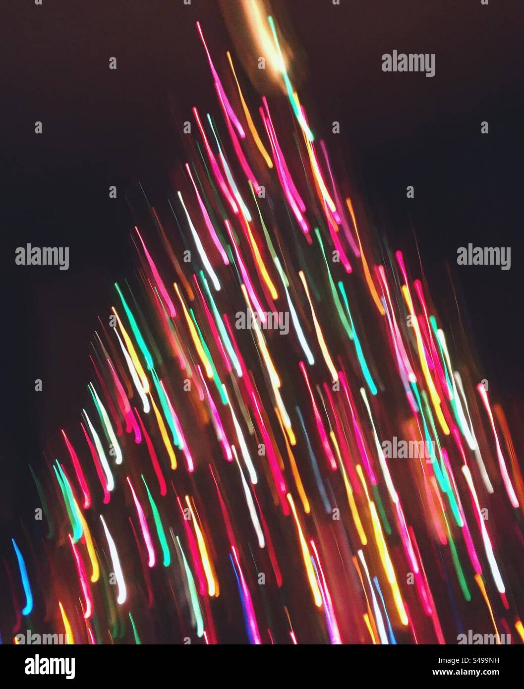 Colorful lights abstract background, abstract Christmas background with festive Christmas tree lights and light trails. - Smartphone Captured Stock Image