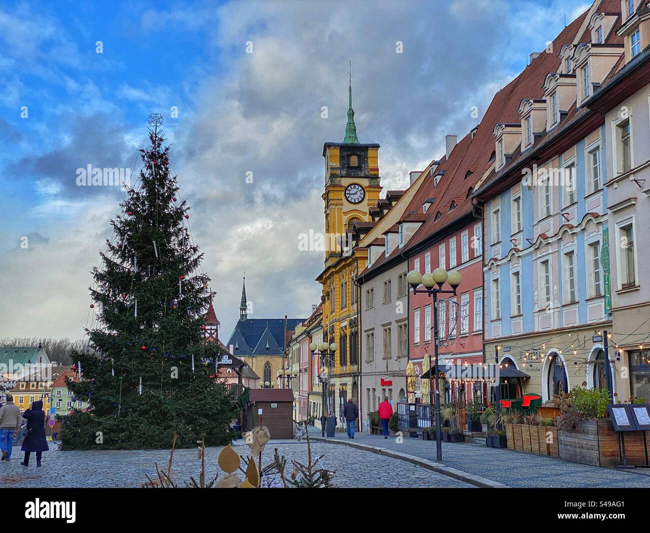 Main square with historic colorful buildings and big Christmas tree in Cheb, Czech Republic. - Smartphone Captured Stock Image