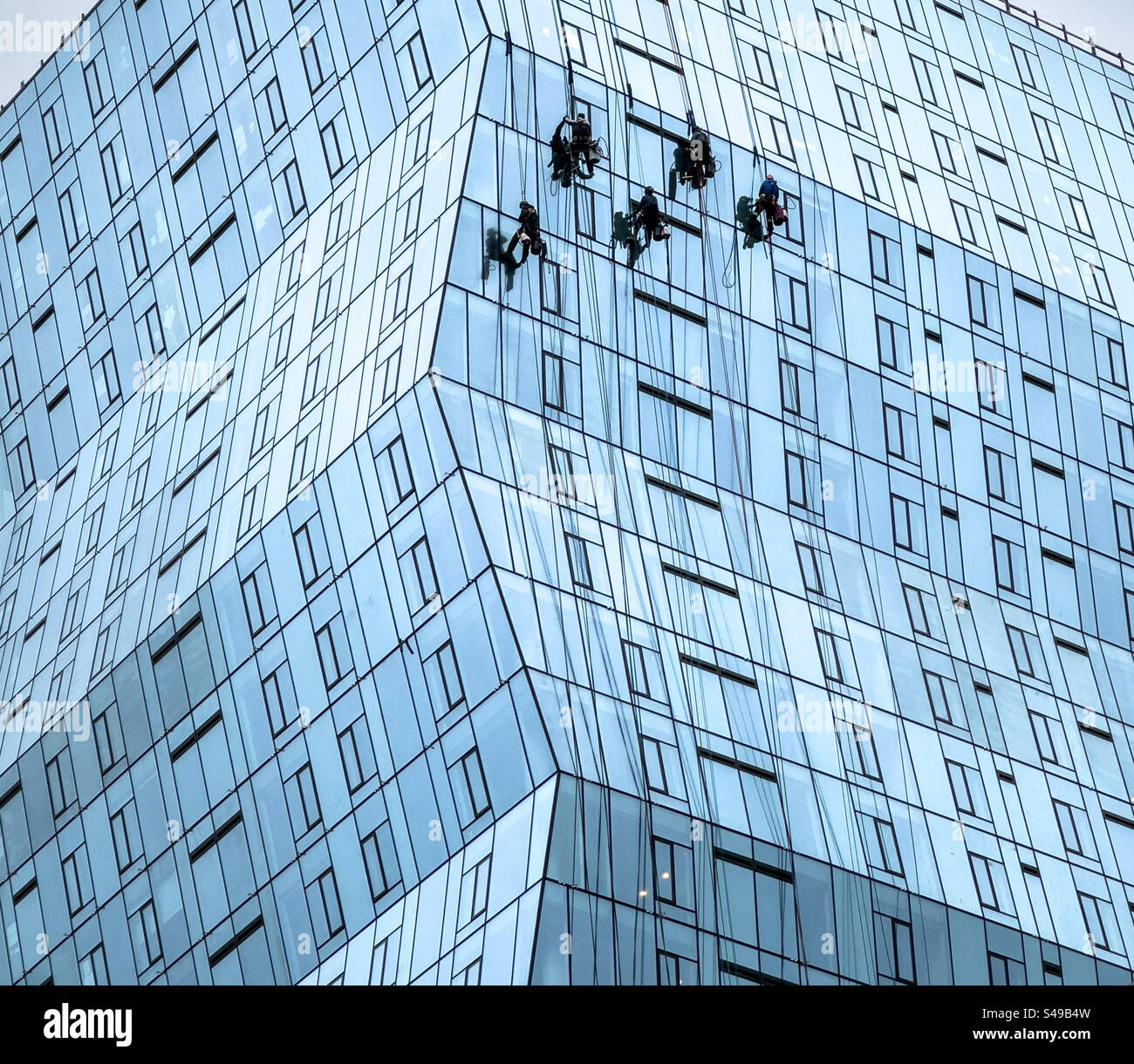 Window washers on a high rise commercial building Stock Photo Alamy