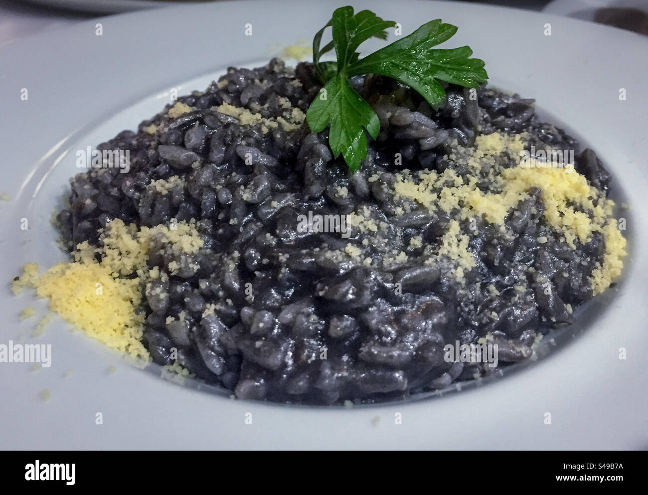 Squid ink risotto Stock Photo