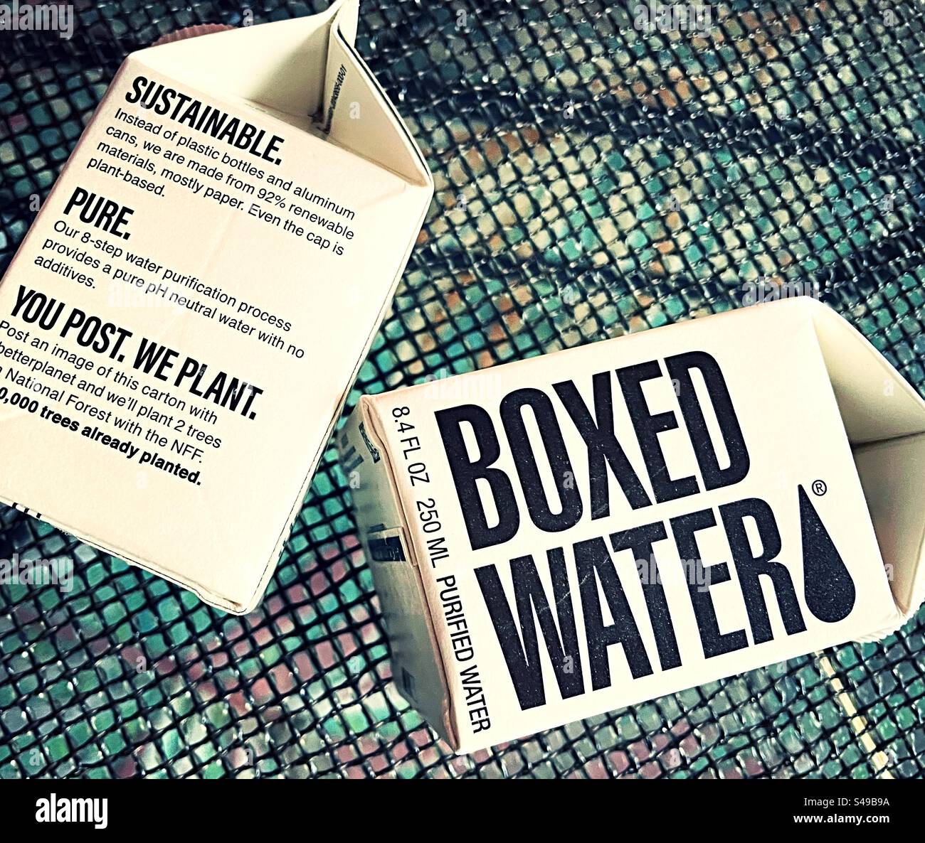 Sustainable cartons of boxed purified, water makes a strong social issue, statement, 2024, United States - Smartphone Captured Stock Image