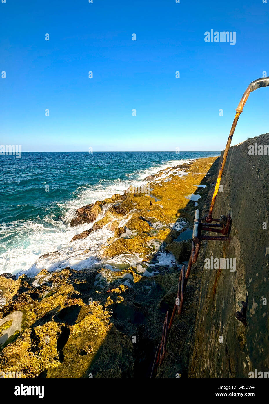 Stairs to go down in Malecón, Havana, Cuba - Smartphone Captured Stock Image