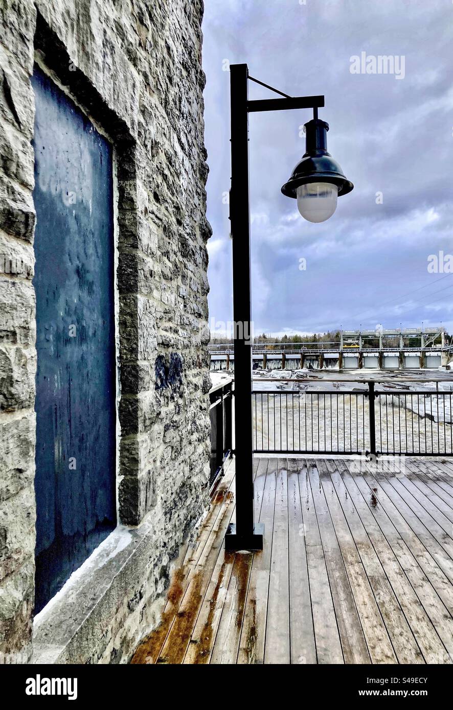 Antique like streetlight against a turn of the century stone building. - Smartphone Captured Stock Image