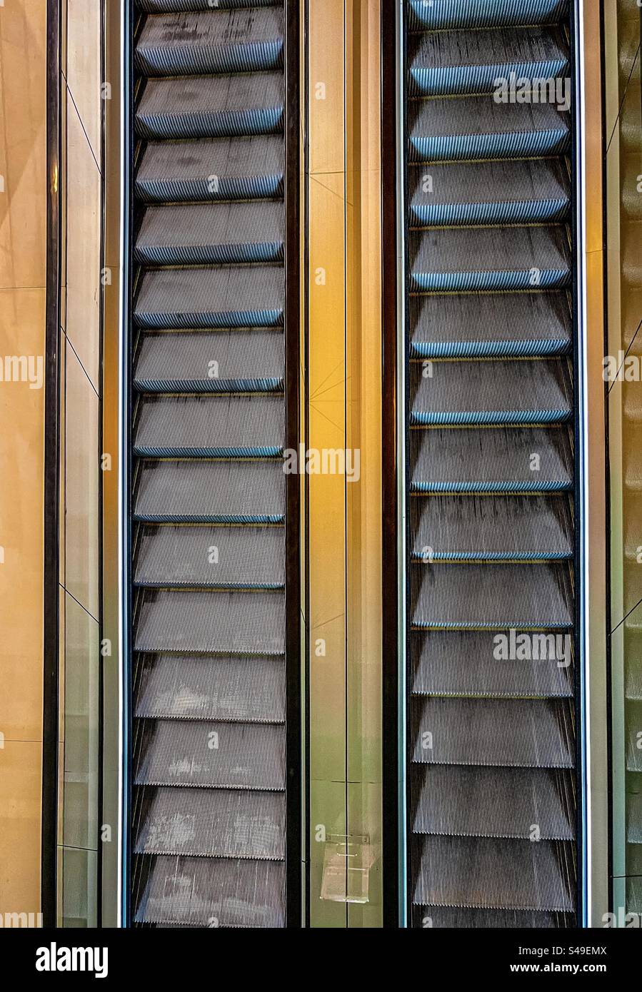 High angle view of two escalators side by side. Full frame backgrounds. Pattern. Textured. - Smartphone Captured Stock Image