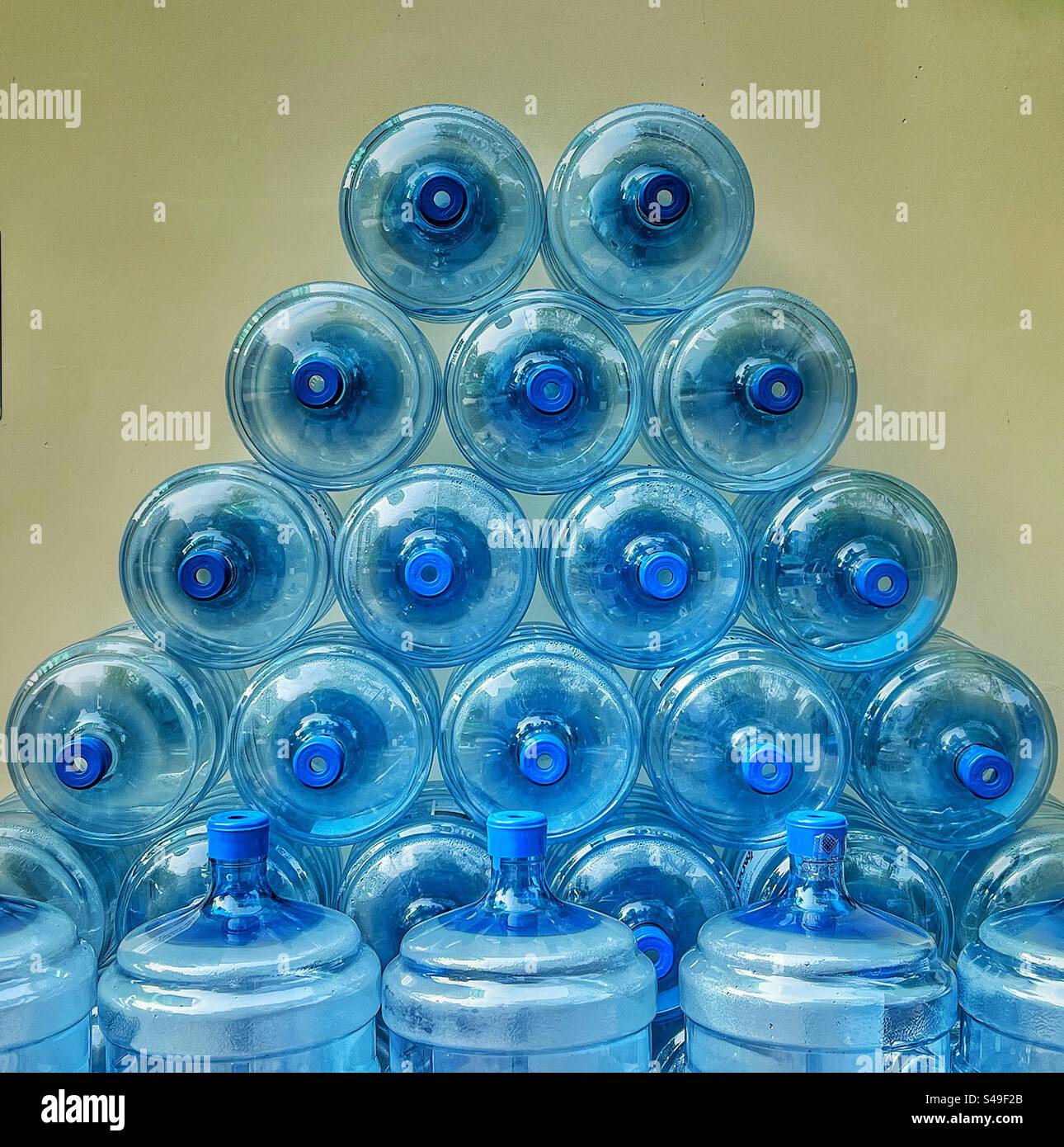 Stacked plastic water bottles for exchange - Smartphone Captured Stock Image