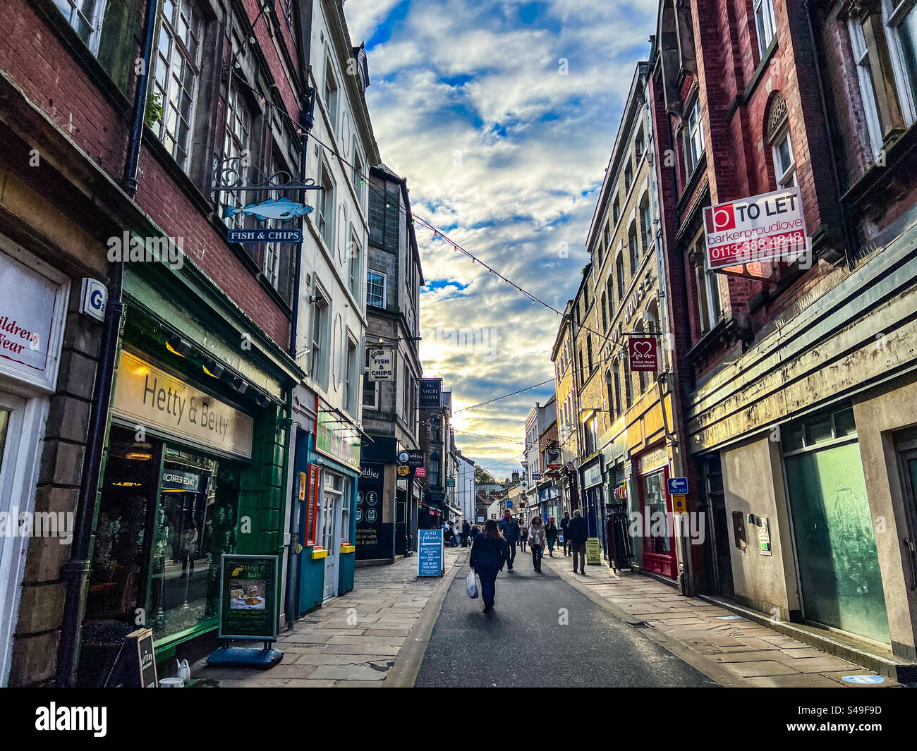 View down Baxtergate high street shopping centre in Whitby North Yorkshire - Smartphone Captured Stock Image