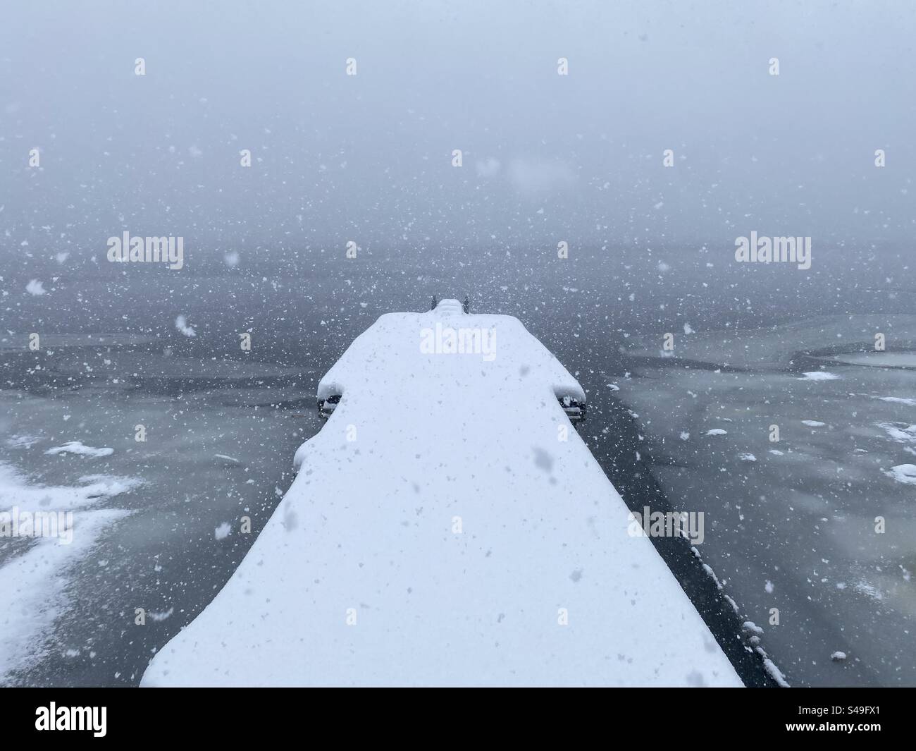 Dock in the winter during a snowstorm - Smartphone Captured Stock Image