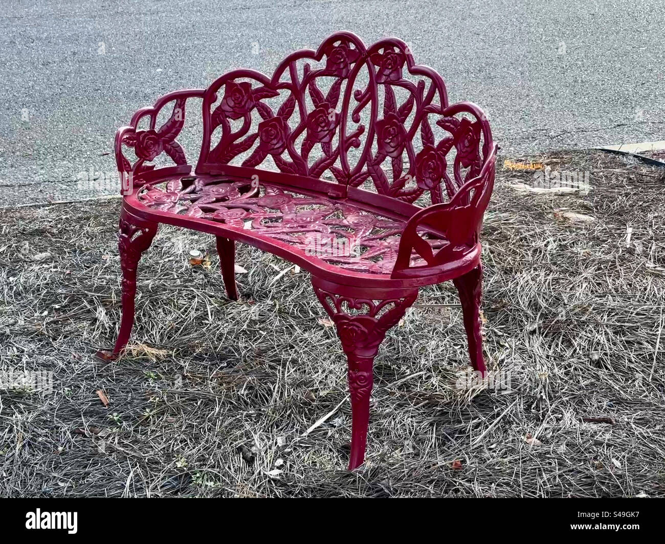 An empty red bench seat. - Smartphone Captured Stock Image