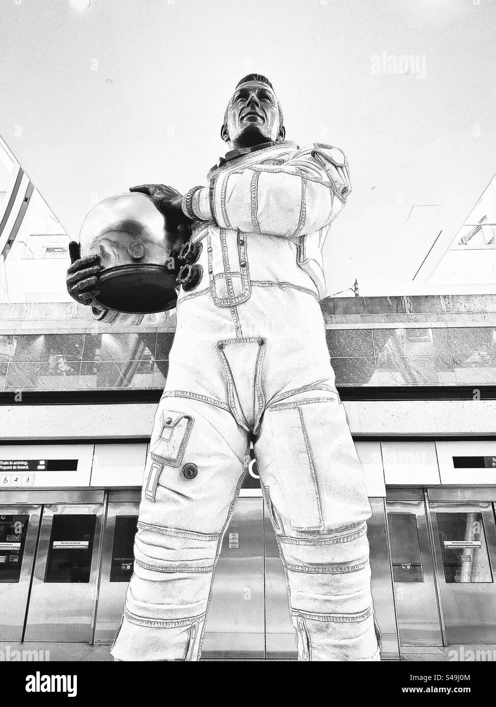 Denver, Colorado, USA:  Statue of John L. “Jack” Swigert, Jr. at Denver International Airport (DIA). American NASA astronaut, engineer, US Air Force pilot, and politician. Black and white filter. - Smartphone Captured Stock Image