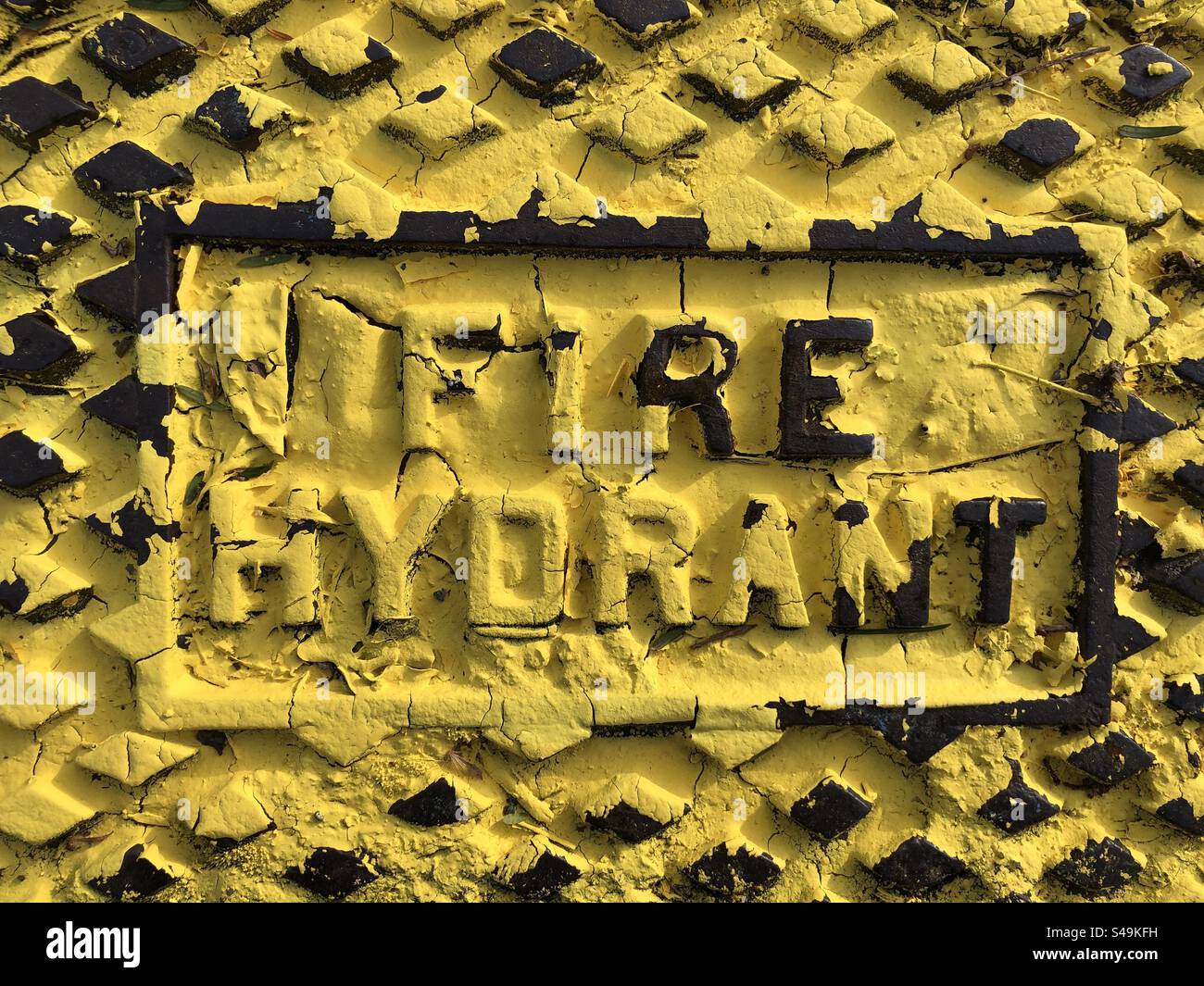 Fire hydrant  cover painted yellow - Smartphone Captured Stock Image