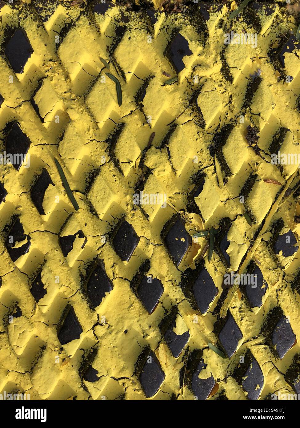 Yellow painted Metal surface with  embossed diamond shapes - Smartphone Captured Stock Image