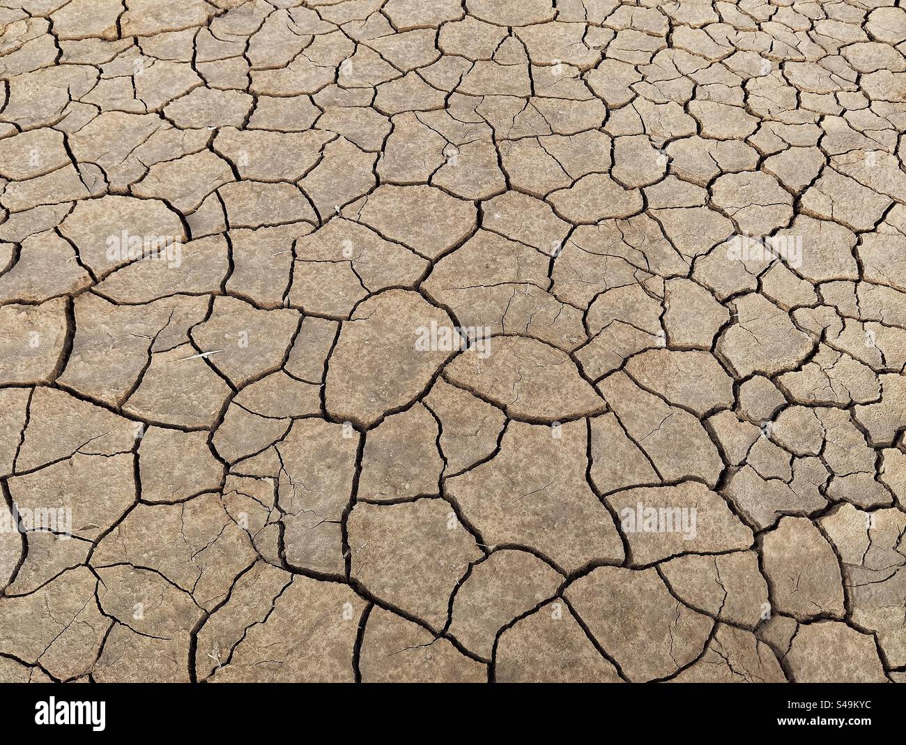 Cracked earth in Occitanie, France - Smartphone Captured Stock Image