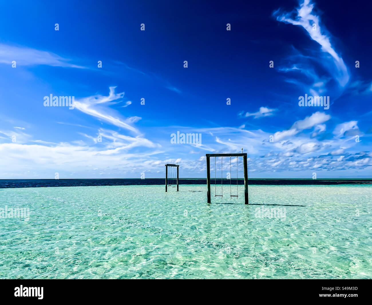 Swings on a sandbar in the middle of the ocean near Spanish Wells