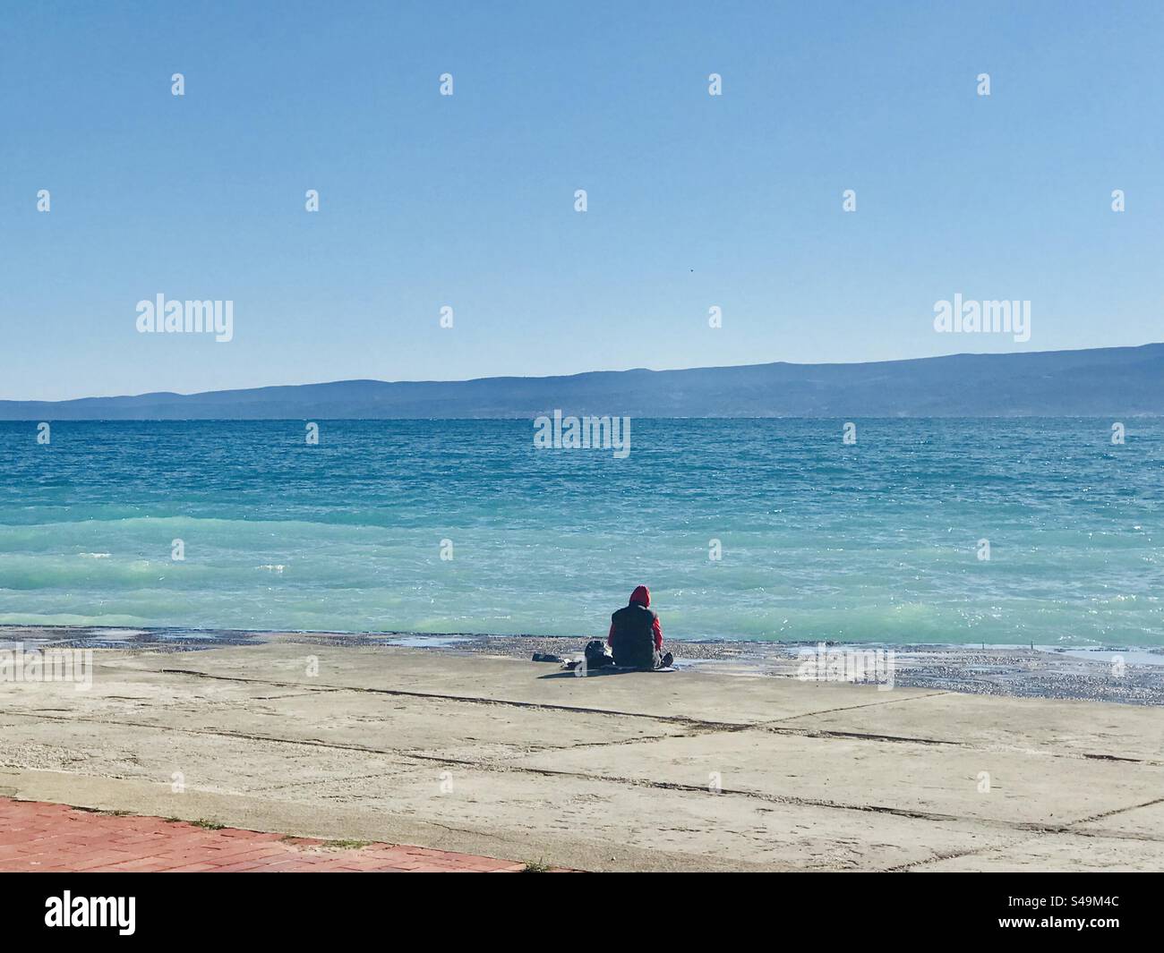 Meditation at the shore of the Adriatic Sea in Split, Croatia - Smartphone Captured Stock Image
