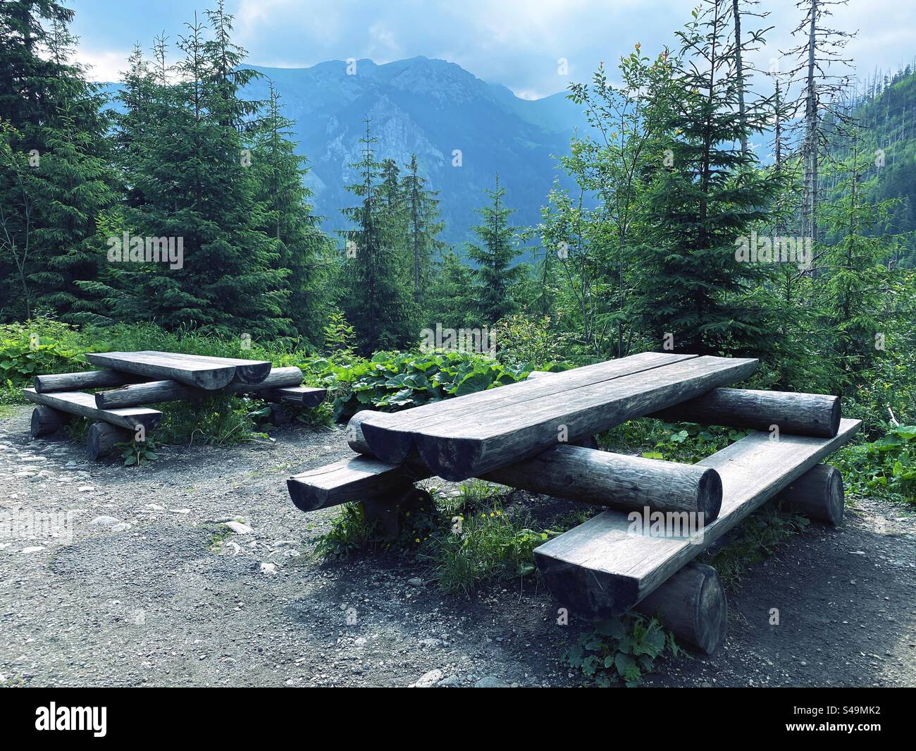 bench with table on mountain trail - Smartphone Captured Stock Image