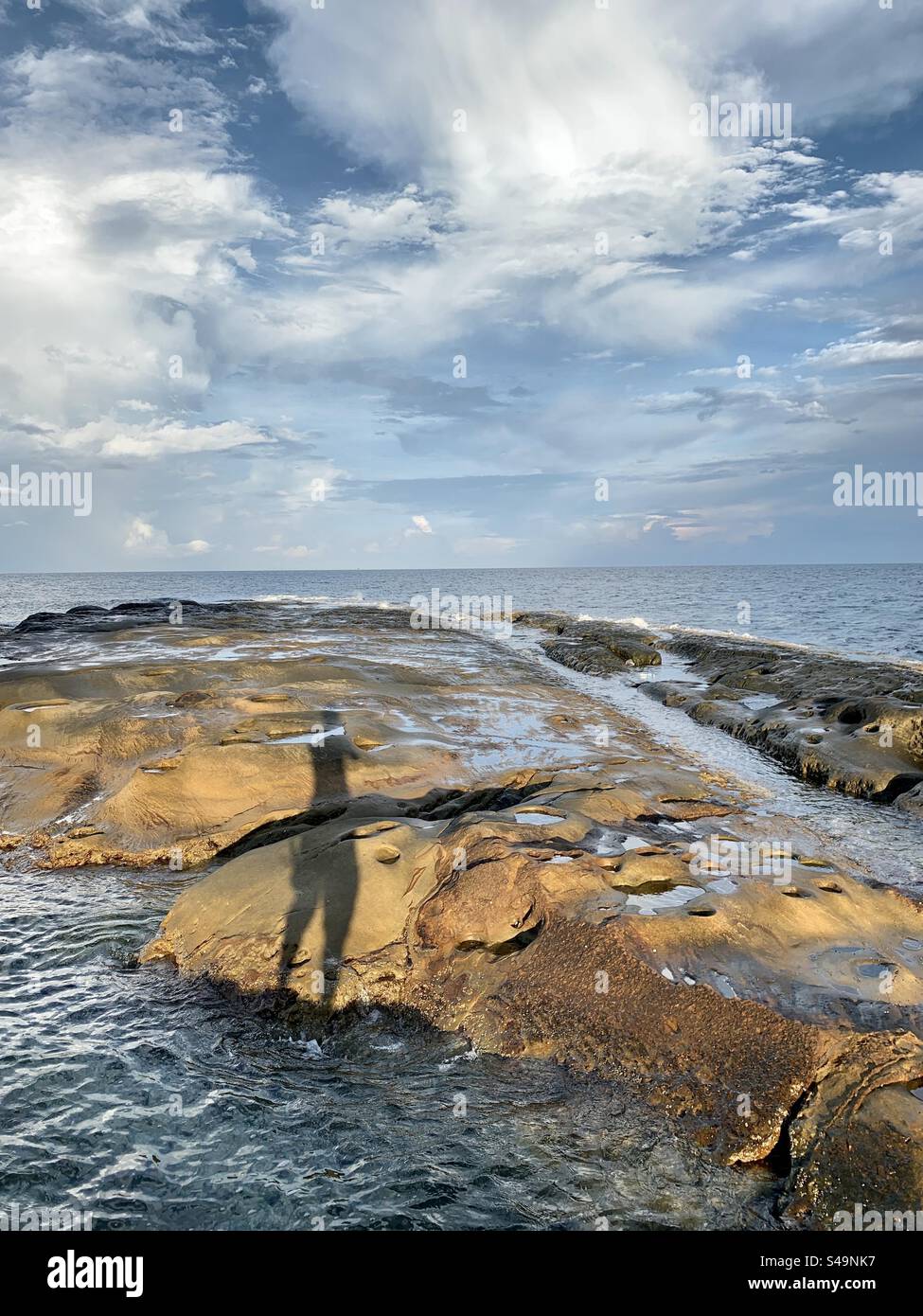 shadow of a man at the tip of Borneo,Kudat,Sabah,Malaysia Stock Photo
