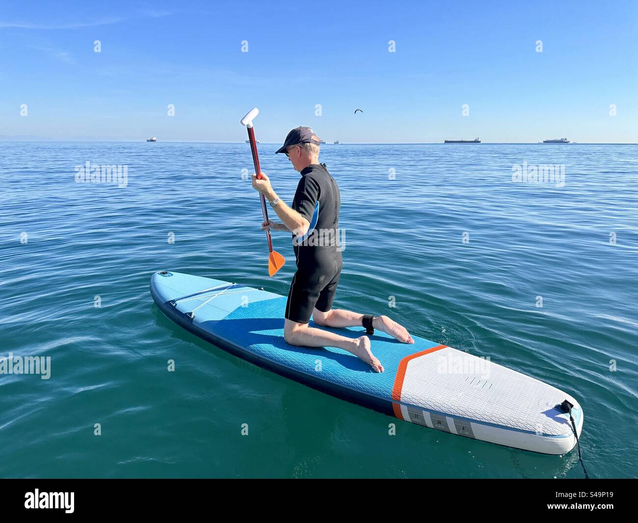 Learning to paddle board - Smartphone Captured Stock Image