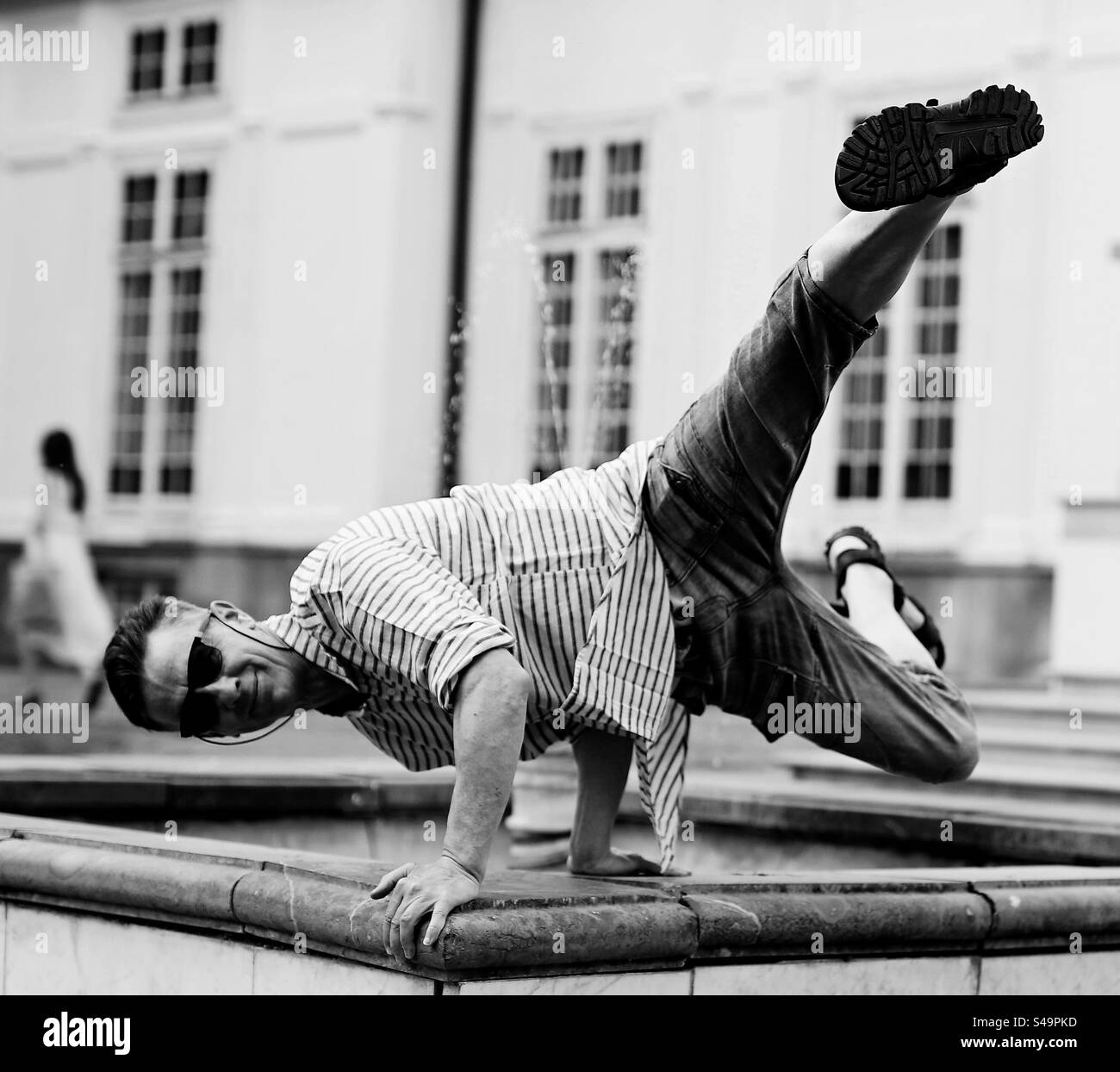 man in sunglasses in breakdancing position - Smartphone Captured Stock Image