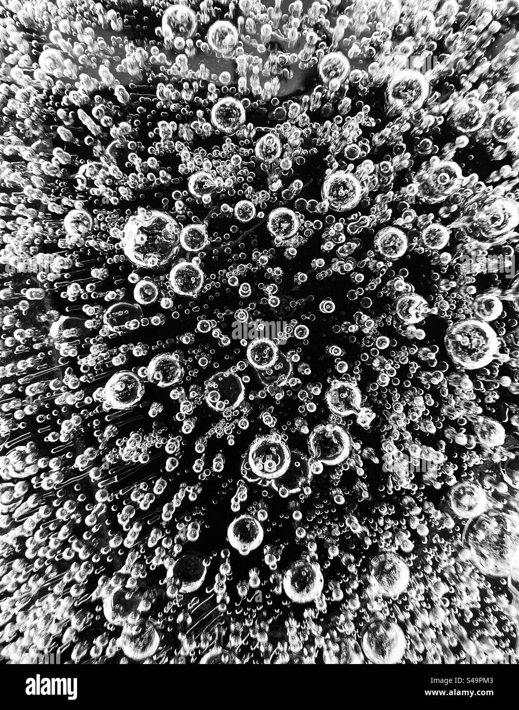 Tiny bubbles frozen in ice. Stock Photo