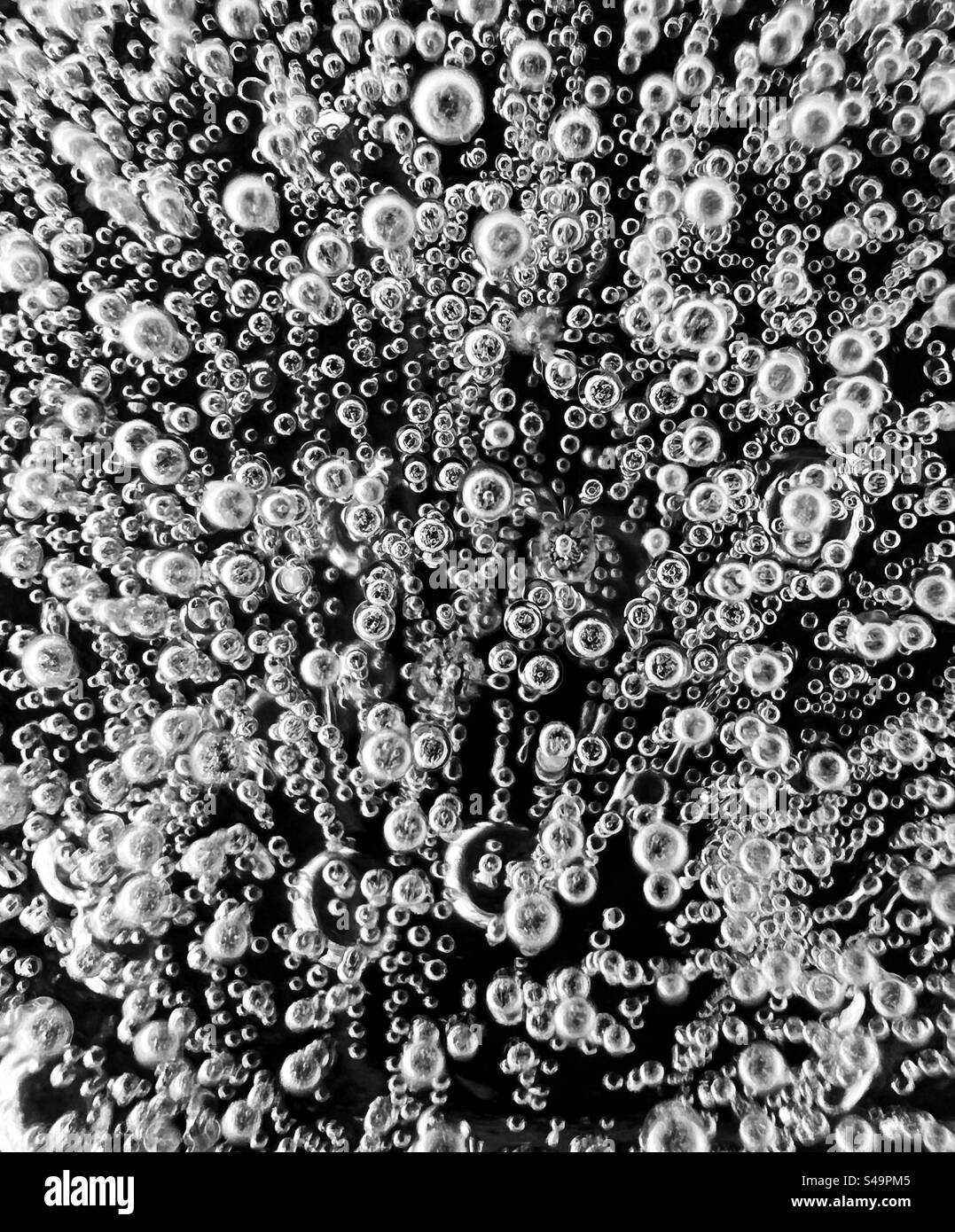 Air bubbles frozen in ice. Stock Photo