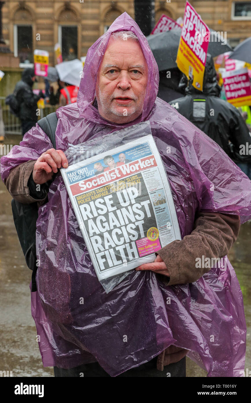 Glasgow, Scotland, UK. 16th Mar, 2019. Several hundred demonstrators turned up, despite the heavy rain, to take part in the Stand up to Racism March through Glasgow city centre as part of the worldwide 'Stand up to Racism' campaign. Several interest groups took part including Pro-Palestine and Anti-Semitic supporters requiring the substantial police presence to keep them apart although all were allowed to take part in the parade. Credit: Findlay/Alamy Live News Stock Photo