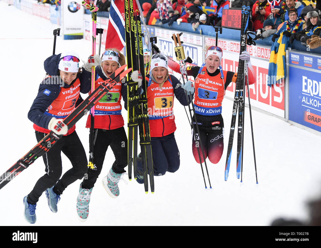 16 March 2019, Sweden, Östersund: Biathlon: World Championship, Relay 4 x 6  km, Women. The Norwegian biathletes are cheering after winning the relay.  L-R: Synnoeve Solemdal from Norway, Ingrid Landmark Tandrevold from