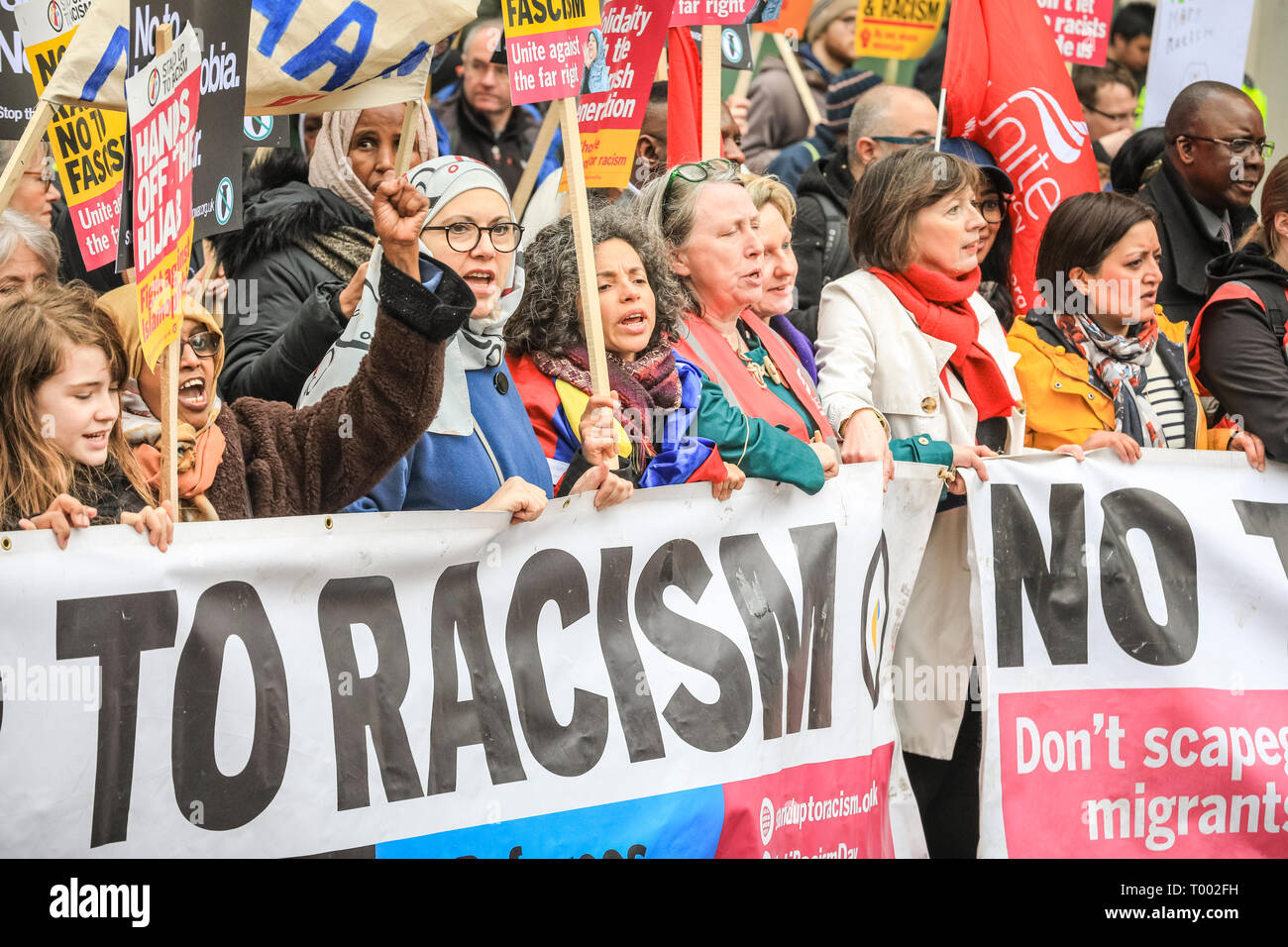 London, UK, 16th Mar 2019. Protesters in central London. A march, organised by activist groups 'Stand Up to Racism' and 'Love Music Hate Racism', and supported by unions TUC and UNISON, proceeds from Hyde Park Corner via Piccadilly and Trafalgar Square to Whitehall and Downing Street in Westminster. Similar events are held in other locations on UN Anti Racism Day. Credit: Imageplotter/Alamy Live News Stock Photo