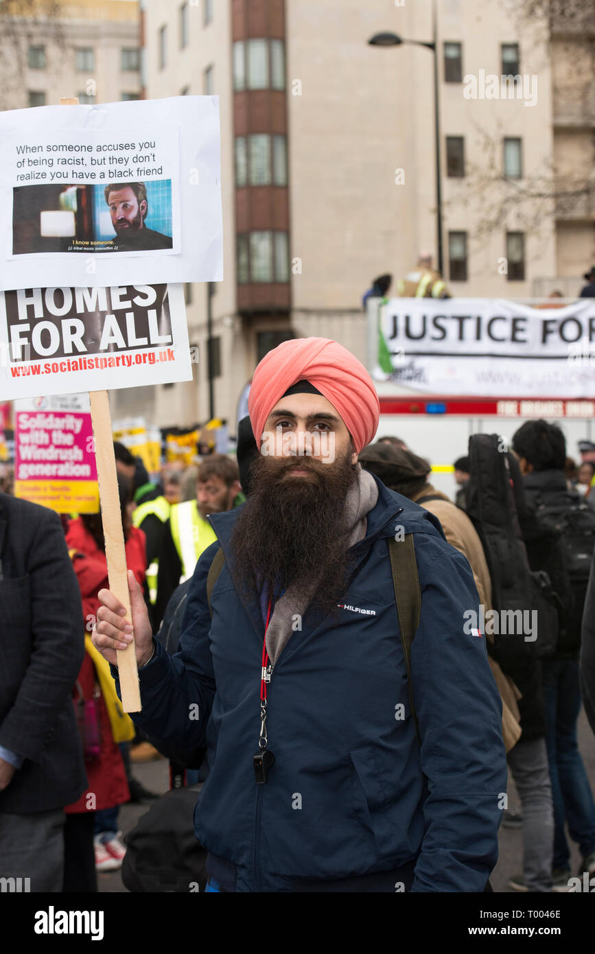 London, UK. 16th March, 2019. Protestors prepare to march in solidarity against racism and xenophobia.   In picture, 26 year old Teacher Singh.   Singh from Gravesham, Kent, says he has seen a rise in 'anti-imigrant behaviour' across his constituency. He expressed his outrage over the use of divisive language during the 2016 Brexit campaign. He believes that 'central government... has to clamp down on the s Credit: Byron Kirk/Alamy Live News Stock Photo