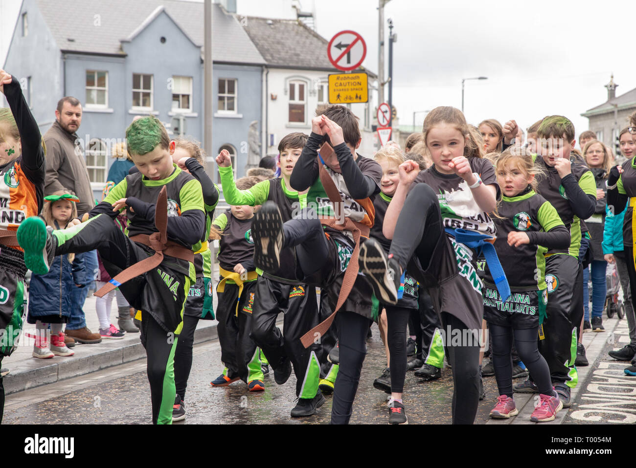 Athlone Town, Ireland. 16th March 2019. The kids from teh Athlone Kickboxing Club shoing off their moves during the 2019 4Athlone St Patricks Day Parade. Credit: Eoin Healy/Alamy Live News Stock Photo