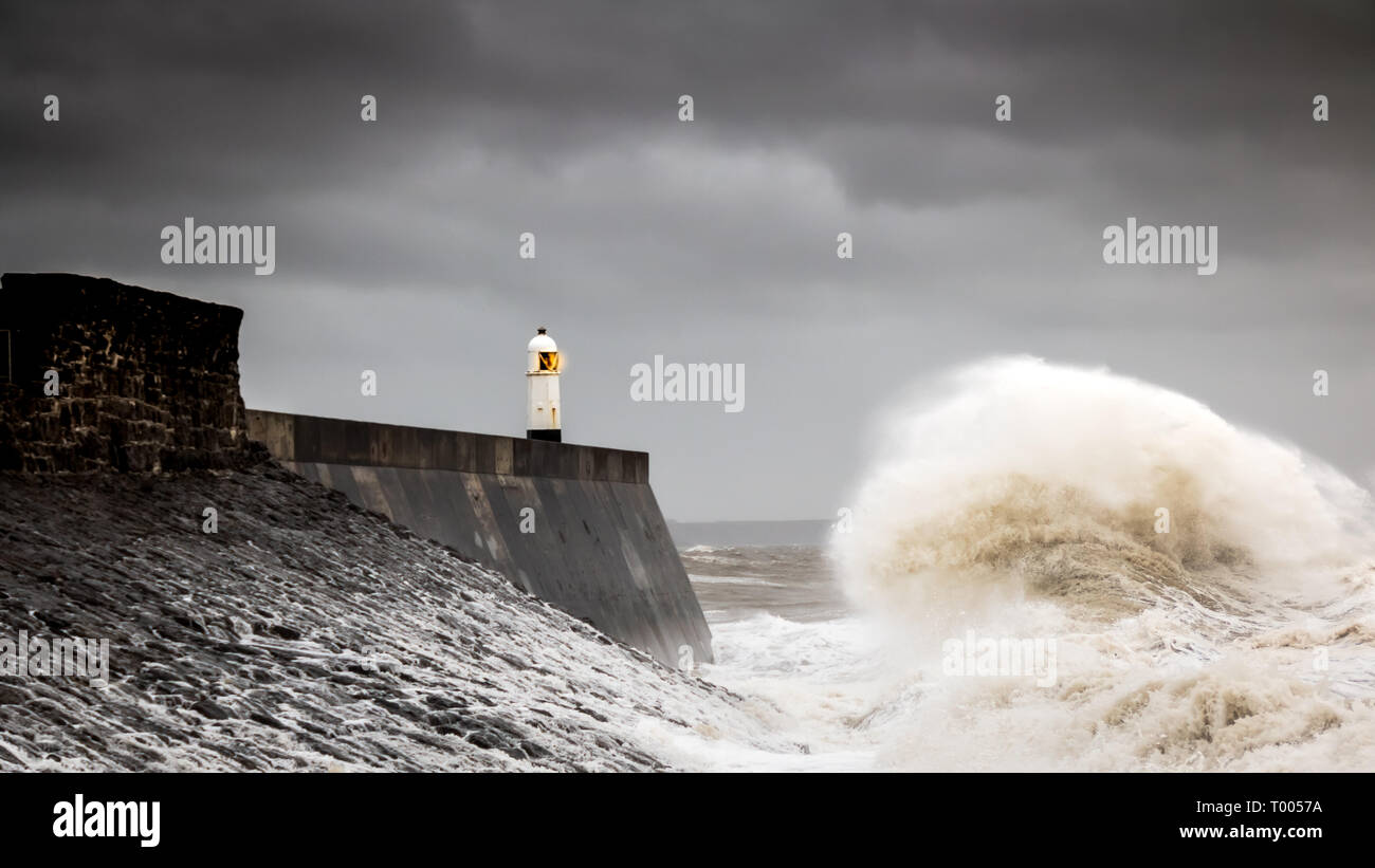 16 march 2019 storm Hannah  batters the small seaside town of Porthcawl  South Wales, with upto 50mph gale force wind, huge waves. harbour , breakwater, pier, photography, news, photographer, people, sea, ocean, extreme weather, danger warning alert. Stock Photo