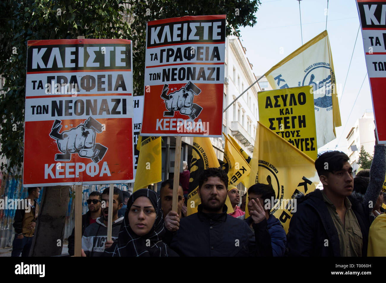 Athens, Greece. 16th March 2019. Migrants and refugees hold placards and shout slogans against racism and closed borders as well as against the greek neo-Nazi party Golden Dawn, currently on trial with accusations such as criminal organization, murder, possession of weapons and racist violence. Leftist and anti-racist organizations staged a rally on the occasion of the International Day against racism to demonstrate against discrimination and racist policies and behaviours. © Nikolas Georgiou / Alamy Live News Stock Photo