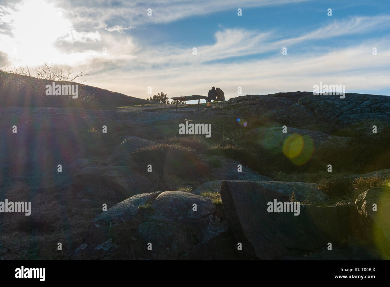 Couple sitting on top hill hi-res stock photography and images - Alamy