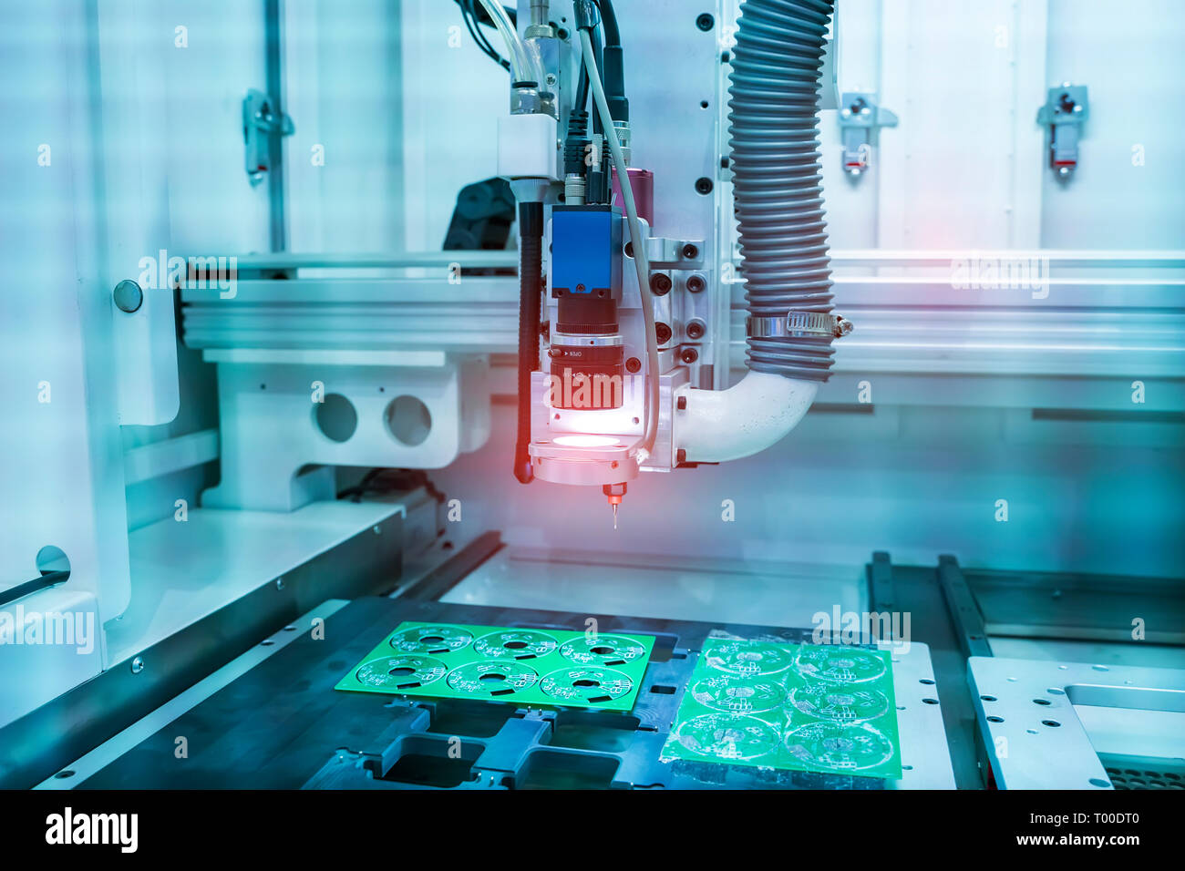 PCB Processing on CNC machine working in factory Stock Photo