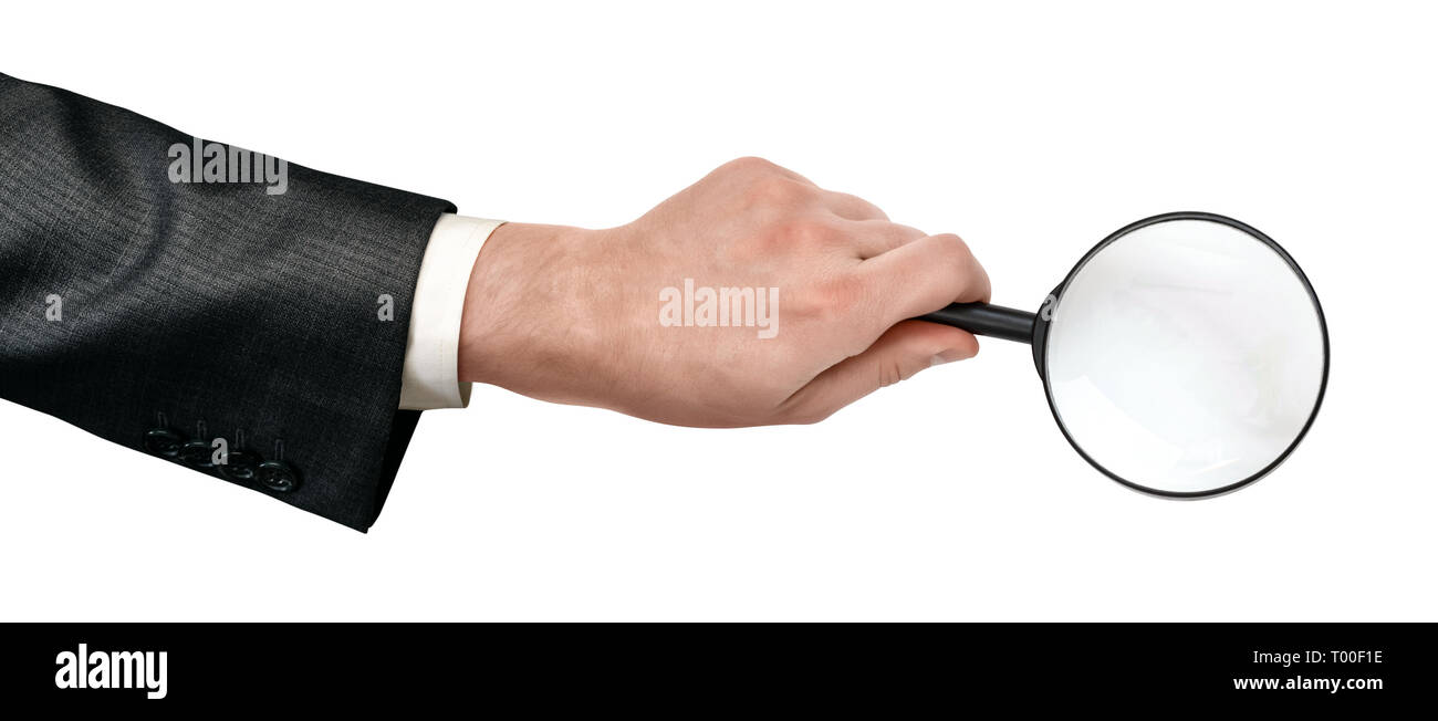 Crop close-up of man's hand holding magnifying glass isolated on white background. Stock Photo