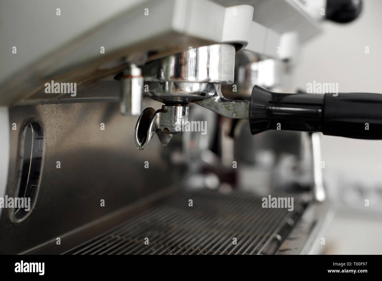 Stainless steel cooking appliance to brew coffee. Parts of coffee machine. Closeup coffee