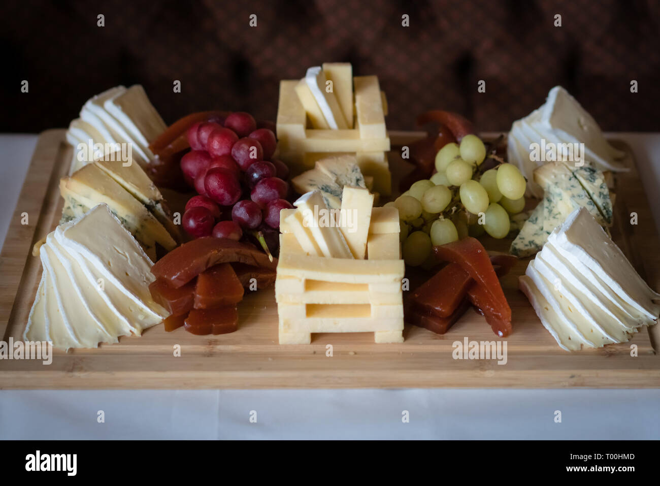 Cheese platter with different cheeses including brie, cheddar and blue