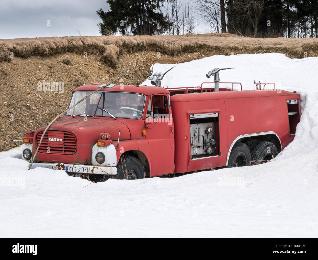 Tatra - vintage fire engine (truck) covered in snow, Rusinski Wierch, Bukowina Tatrzanska, southern Poland Stock Photo