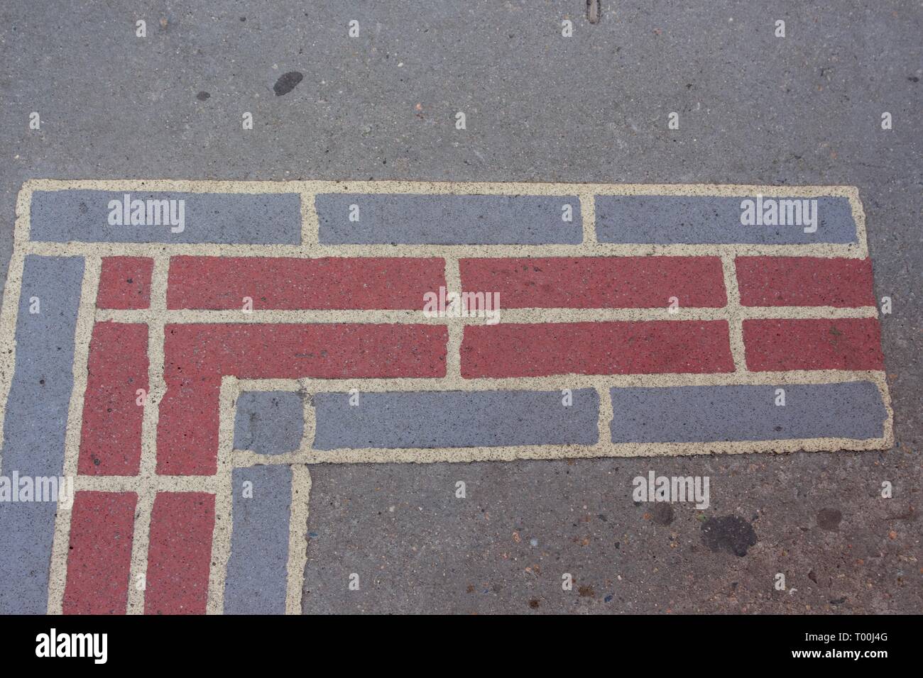 Boston freedom trail is marked by a red brick line on the sidewalk guiding you across the trail Stock Photo