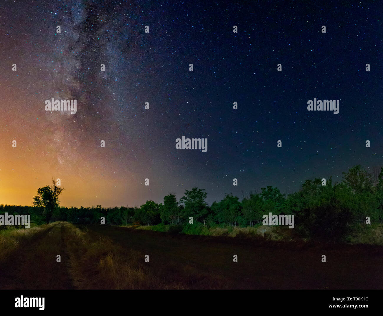 Awesome panoramic night landscape under the Milky Way galaxy and starry sky in Krivoy Rog, Dnipropetrovsk region, Ukraine Stock Photo