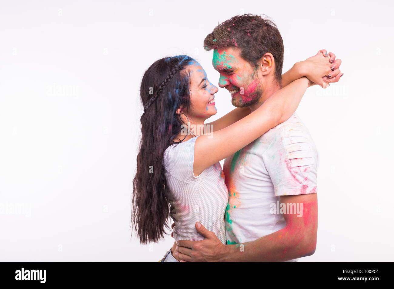 Friendship, love, festival of holi, people concept - young couple ...