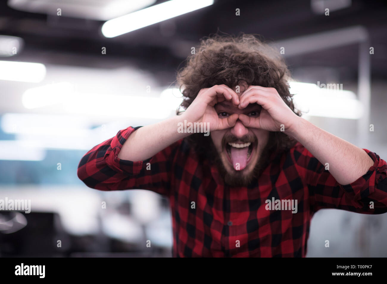 Portrait of young smiling successful male software developer standing ...