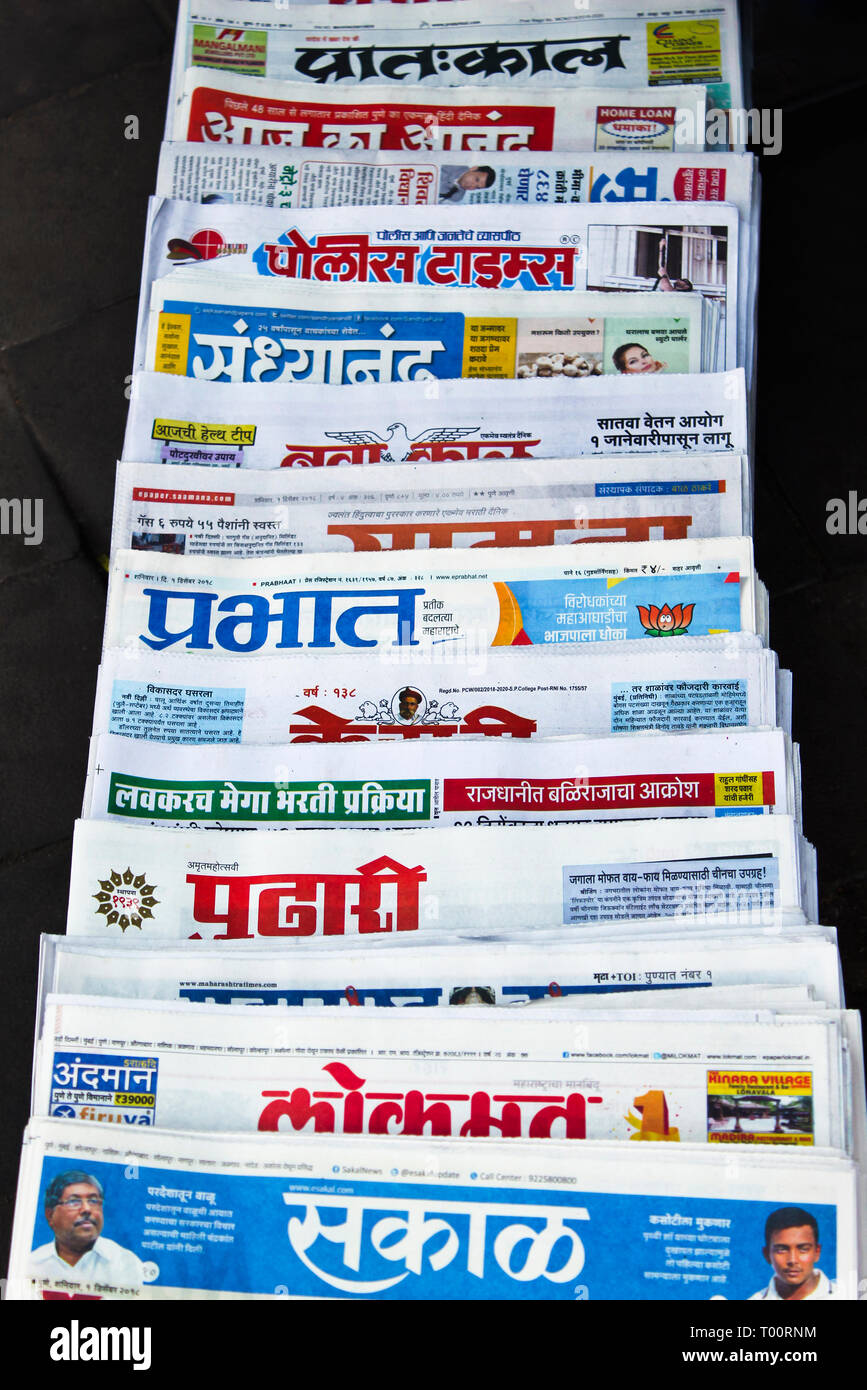 Various newspapers on sale on street, Maharashtra, India. Stock Photo
